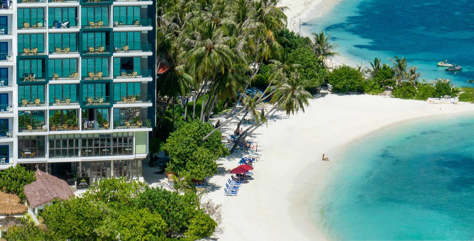 Arena Beach Hotel beachfront facade and palms, Maafushi