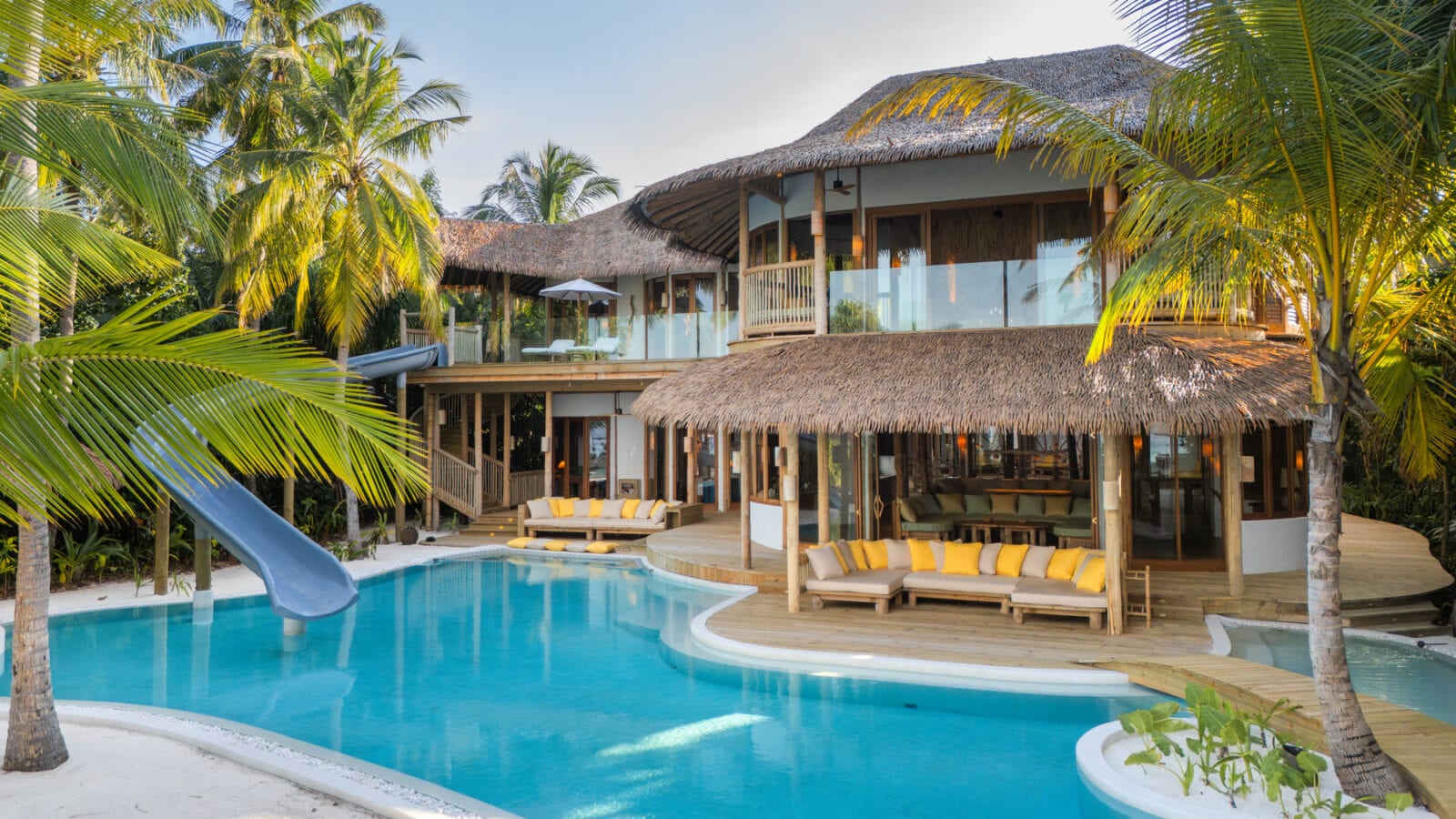 The 5-bedroom Residence — Villa 311 — at Soneva Fushi, Baa Atoll: beachfront living room opening onto the UNESCO Biosphere lagoon.