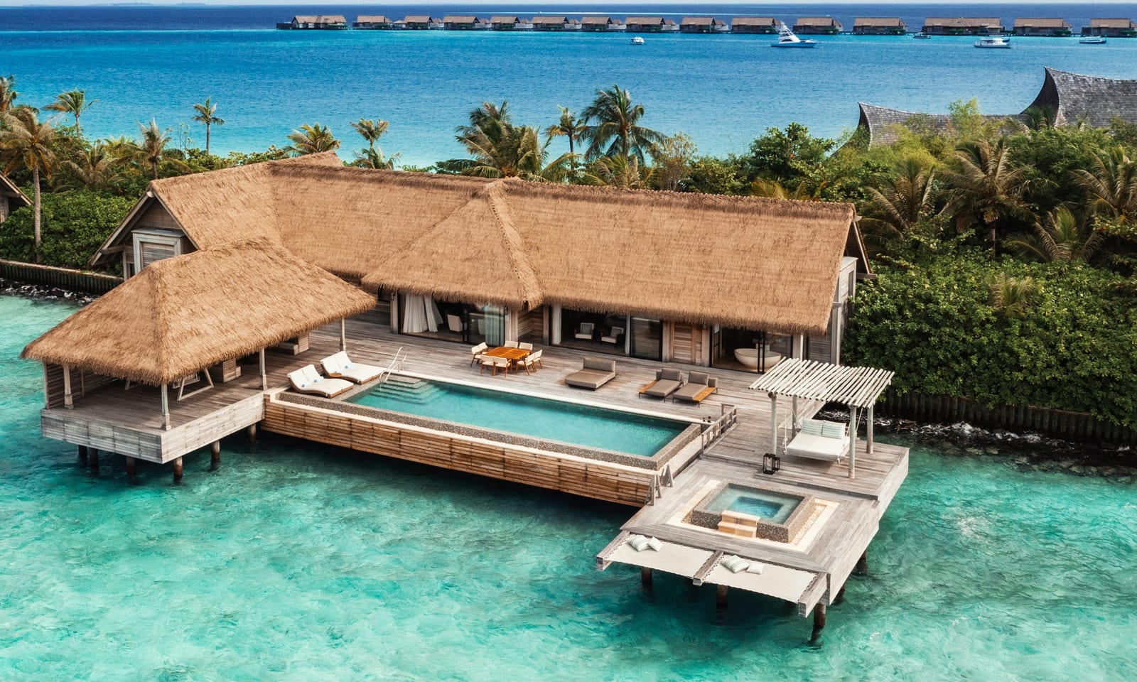 Overwater villas at Waldorf Astoria Maldives Ithaafushi in South Malé Atoll — three connected islands, 117 villas.